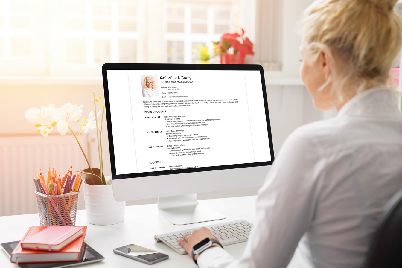 Woman Creating Her CV on Computer. 